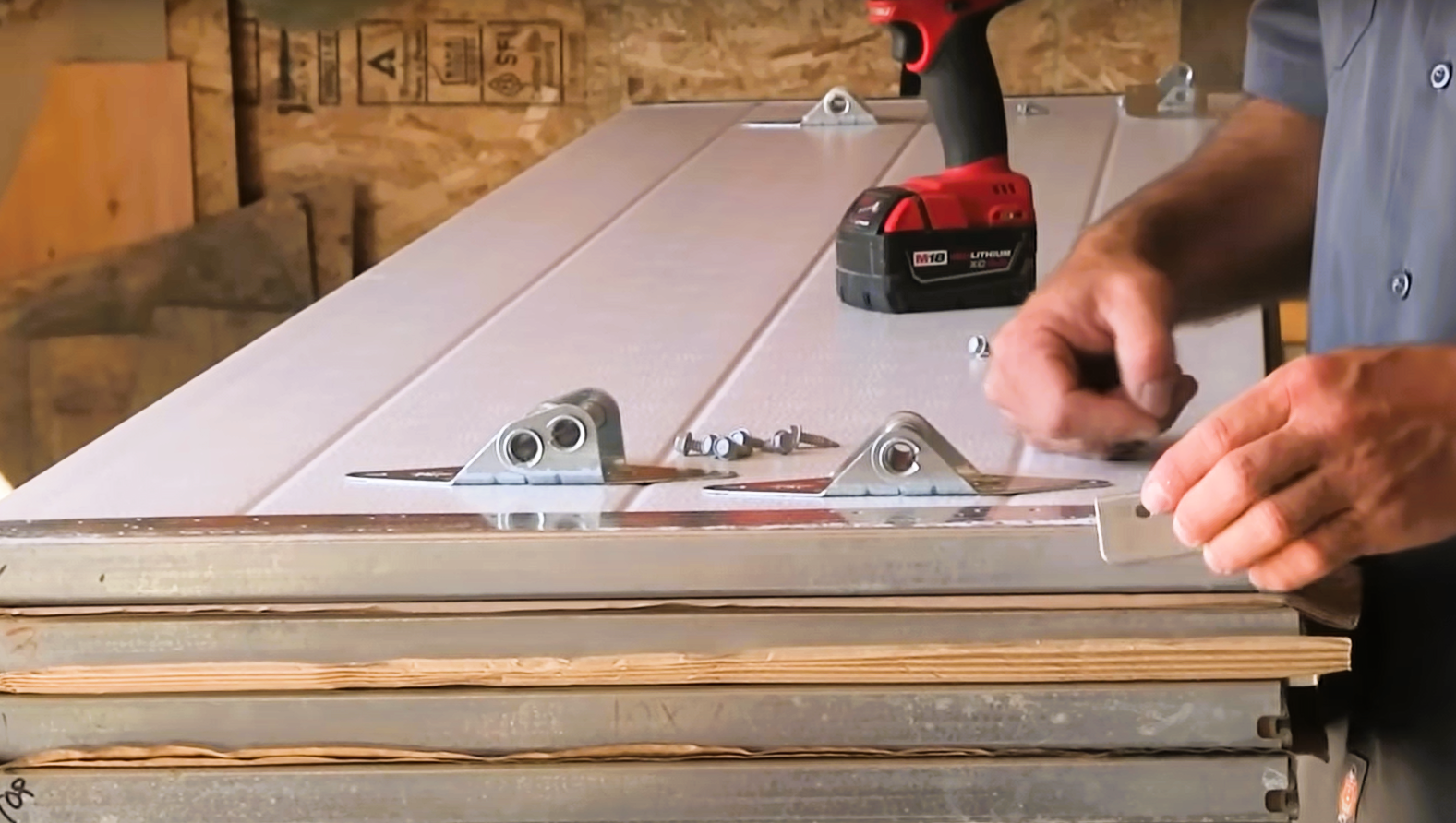 Technician performing a garage door panel in Venice, Florida, ensuring smooth and efficient operation for residential property owners.